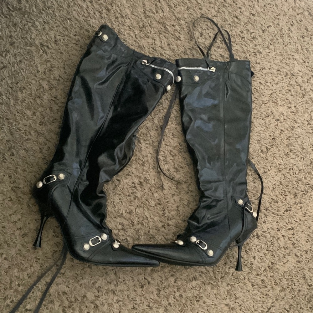 Black boots with silver buckles